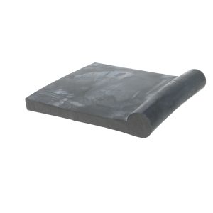 Black foam roller piece lying diagonally on a white background, showing a cylindrical, rounded end and textured surface markings.