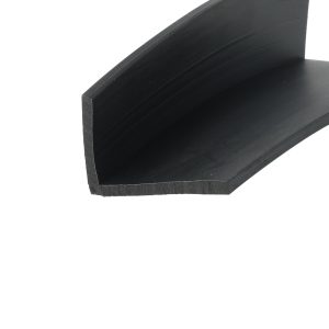 Close-up of a black wood shelf edge with visible grain and a squared corner at the bottom left.