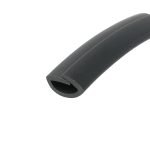 Close-up of a dark gray cylindrical tube with a square hollow end, photographed diagonally across a white background.