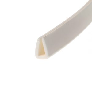 Close-up of a white curved plastic object with a beige inner lining, angled across a white background.