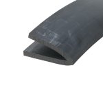 Close-up of dark slate tiles stacked diagonally, showing rough edges and subtle scratch marks on the surface.