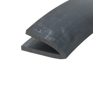 Close-up of dark slate tiles stacked diagonally, showing rough edges and subtle scratch marks on the surface.