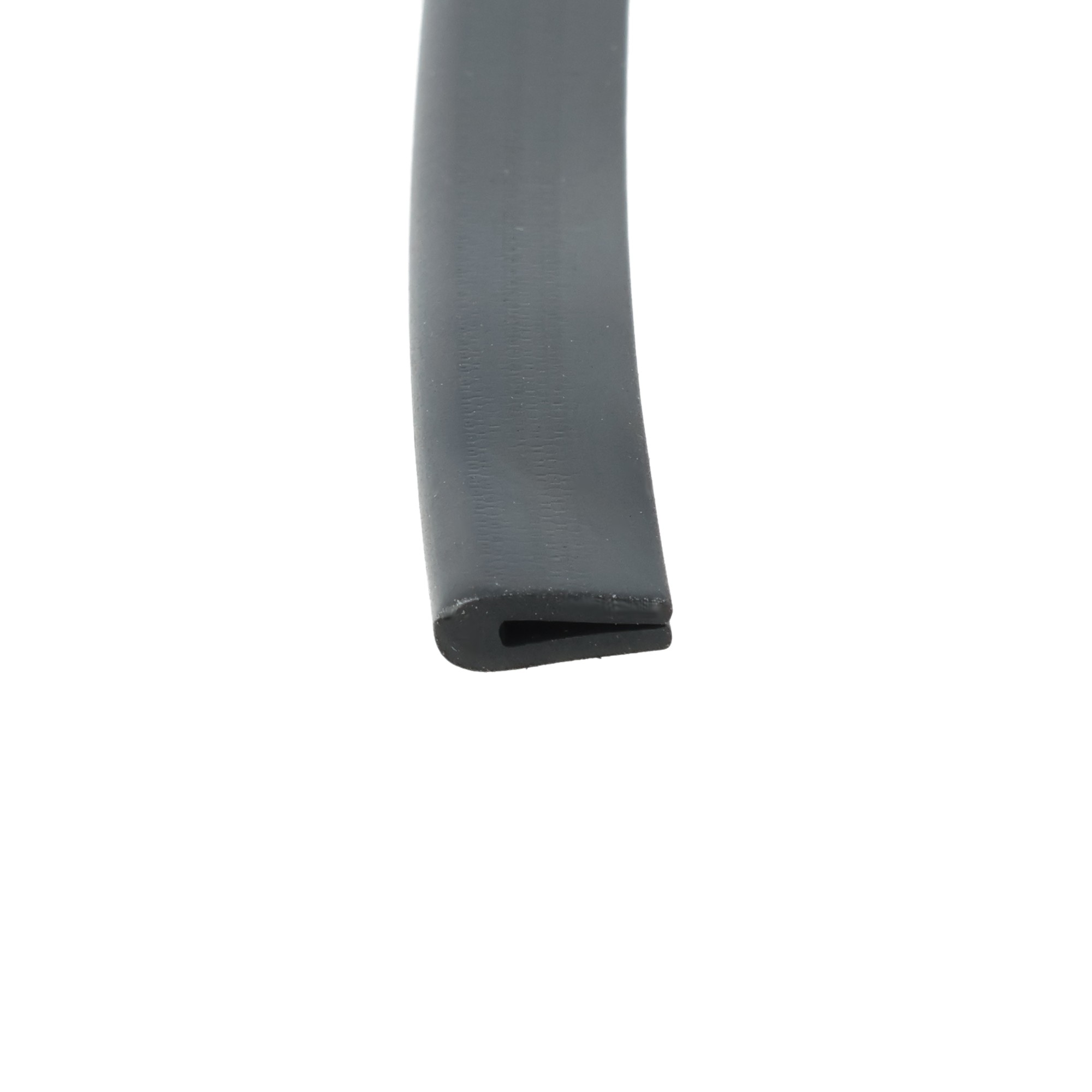78-100_1115 - Centrum uszczelek Close-up of a dark gray metal blade with a rounded U-shaped notch at the tip.