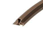 Close-up of a brown plastic extrusion with hollow inner channels, angled across the image.