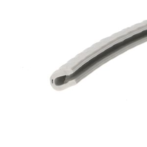 Close-up of a light-gray plastic tool with a rounded hollow tip and a dark groove along its edge, viewed at an angle.