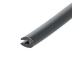 Close-up of a black cylindrical pipe diagonally across a white background, showing a chipped end with a hollow interior.