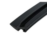 Close-up of a black plastic component with ridged channels and a curved edge.