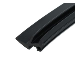 Close-up of a black plastic component with ridged channels and a curved edge.