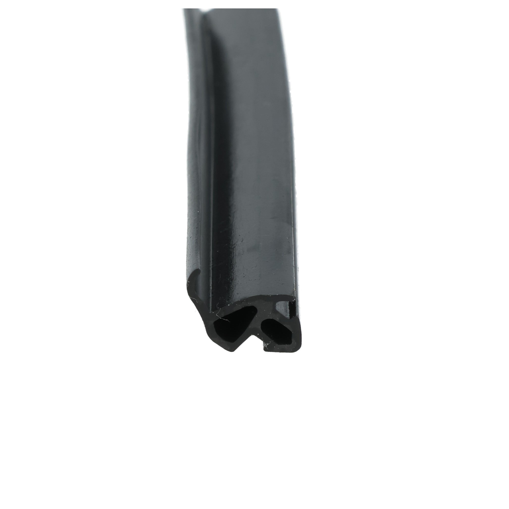 uszczelka-do-okien-pcv-czarna-s-1559-12-809-5 - Centrum uszczelek Close-up of a curved, glossy black metal edge against a white background, showing a rounded, industrial component.