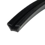 Close-up of a black Velcro strap with a fuzzy surface affixed to a gray plastic edge, viewed diagonally