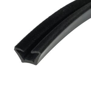 Close-up of a black Velcro strap with a fuzzy surface affixed to a gray plastic edge, viewed diagonally