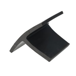 Close-up of a black electronic device corner with a gray metal edge and slight dust specks