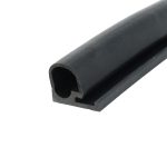 Close-up of a black foam rubber extrusion with a hollow U-shaped cross-section along its edge