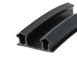 Close-up of a black metal U-shaped extrusion with internal slots forming a channel (rail cross-section)