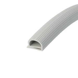 Grey corrugated plastic pipe curved across a white background, showing ribbed surface and hollow interior