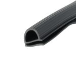 Close-up of a black rubber belt with multiple grooved ribs, curved into a coil/roll.