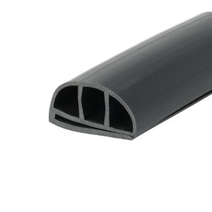 Close-up of a dark gray curved plastic tube with a circular opening and visible interior supports at the end edge.