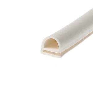 Close-up of a white plastic part with rounded cutouts and beige circular holes, photographed at a diagonal angle.