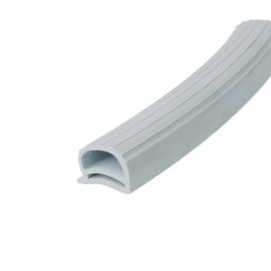 Close-up of a light gray curved plastic cable management channel with a ribbed surface surface.