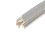 Close-up of a white plastic channel with a beige inner cavity, diagonal across the frame.
