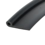 Close-up of a black cylindrical tube with a circular hollow end visible at the bottom left.