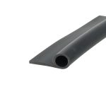 Close-up of a dark gray metal bar with a rounded hole near the end, photographed at an angle.