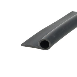 Close-up of a dark gray metal bar with a rounded hole near the end, photographed at an angle.