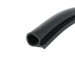 Close-up of a black cylindrical pipe with a hollow circular opening, showing a smooth surface and angled cut, diagonal in the frame.