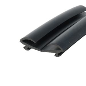 Close-up of a black cylindrical plastic tube with a curved groove, showing a hollow cross-section and smooth glossy surface