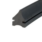 Close-up of a dark matte metal piece with a rounded outer edge and cut-out notch, likely a hardware component detail.