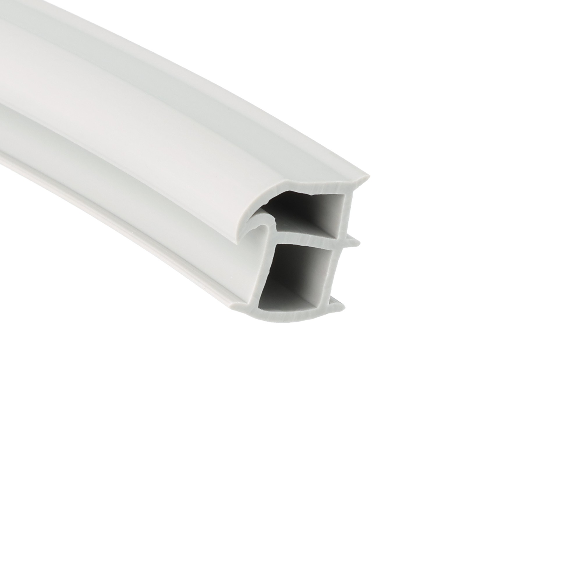 uszczelka-drzwi-oscieznicy-chlodni-mrozni-145-x-15mm-szara-026016-1 - Centrum uszczelek Close-up of a white plastic U-channel extrusion with hollow interior sections tilted diagonally.