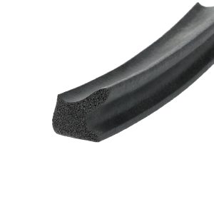Close-up of a black foam seal or gasket with a hollow, porous interior and curved extrusion.