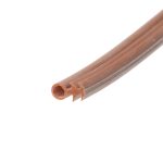 Close-up of brown hollow plastic tubes with ridged exterior, laid diagonally across the image.