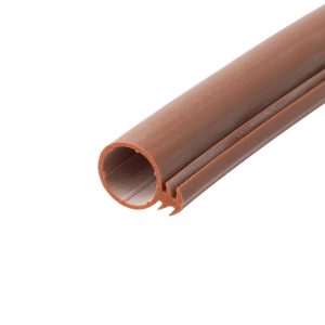 Close-up of brown hollow plastic tubing with ridges running along its length, set diagonally on a white background.