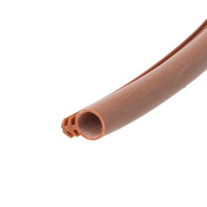 Close-up of a brown chocolate wafer tube with a hollow core against a white background.