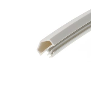 Close-up of a white plastic channel or extrusion with beige interior, angled across the right side of the image.