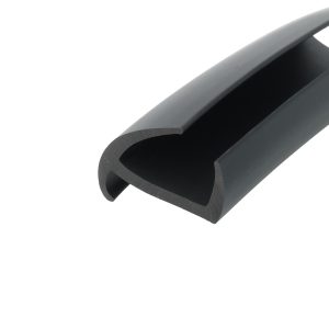Close-up of a black plastic clip or clamp with a rounded inner channel, viewed at an angle.
