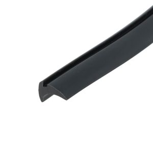 Close-up of a black metal bar running diagonally across a white background, with a rounded, beveled end visible in the corner.