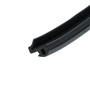 Close-up of a black grooved plastic rail angled diagonally across the frame.