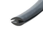 Close-up of a black metal blade with a curved notch, photographed at a diagonal angle.