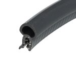 Close-up of a black foam cylindrical tube with a hollow center and porous cut end (foam seal).