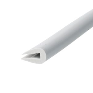 Close-up of a gray utility knife with a protruding sharp blade. Showcasing the blade edge and plastic housing formed in a cylindrical shape.