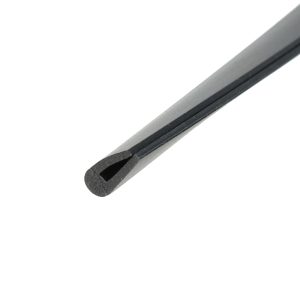 Close-up of a diagonal metal utility blade edge with a dark groove along the length.