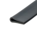 Close-up of a dark gray cylindrical metal tube with a rounded end and a circular hole, diagonally oriented across the frame.