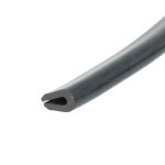 Close-up of a black metal tool with a sharpened, wedge-like tip on a white background