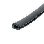 Close-up of a dark gray metal strip with a rounded end, diagonally placed on a white background.
