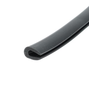 Close-up of a dark gray metal strip with a rounded end, diagonally placed on a white background.