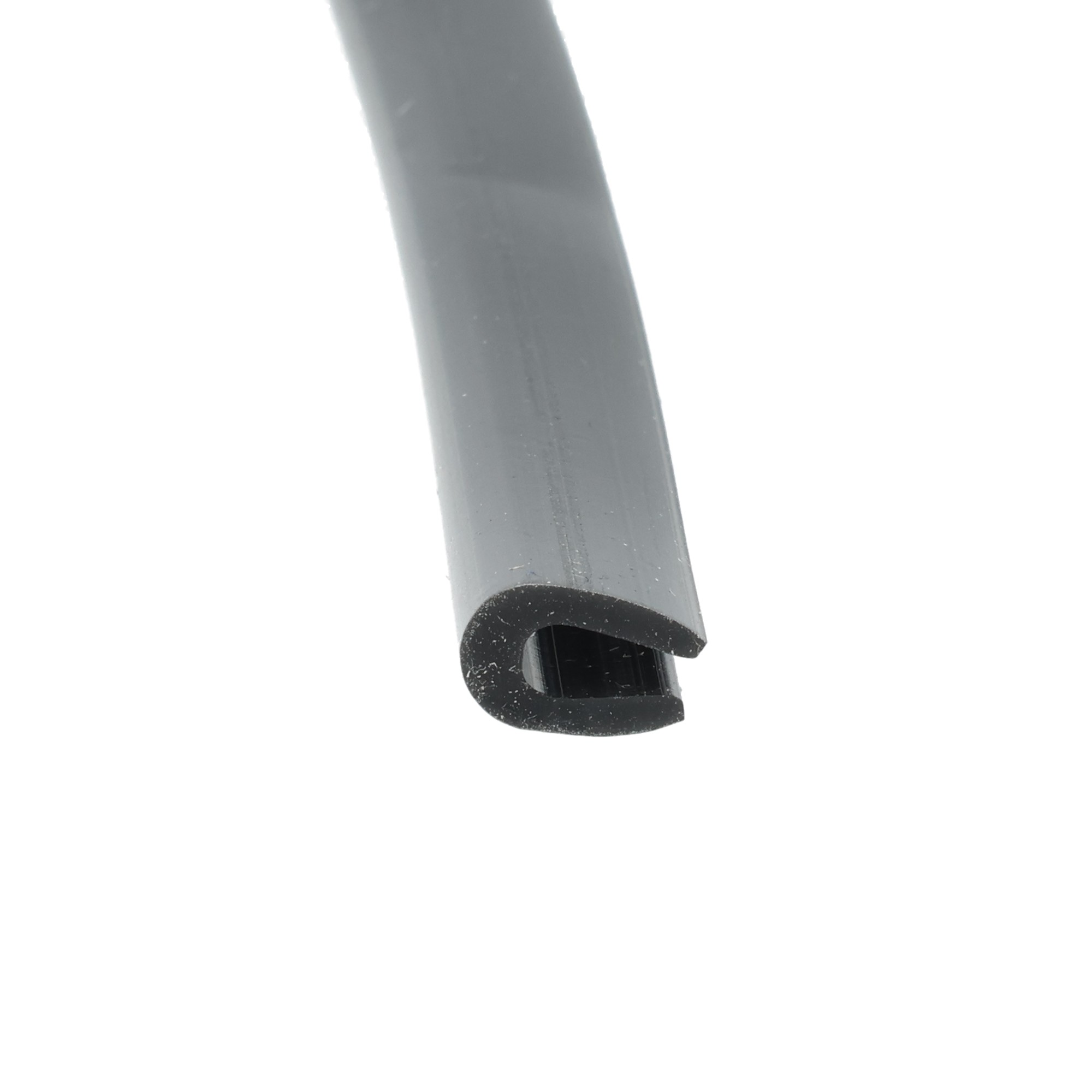 uszczelka-krawedziowa-lity-silikon-2-x-5-x-9mm-czarna-023810-3 - Centrum uszczelek Close-up of a gray cylindrical tube bending diagonally with a black curved end cap.