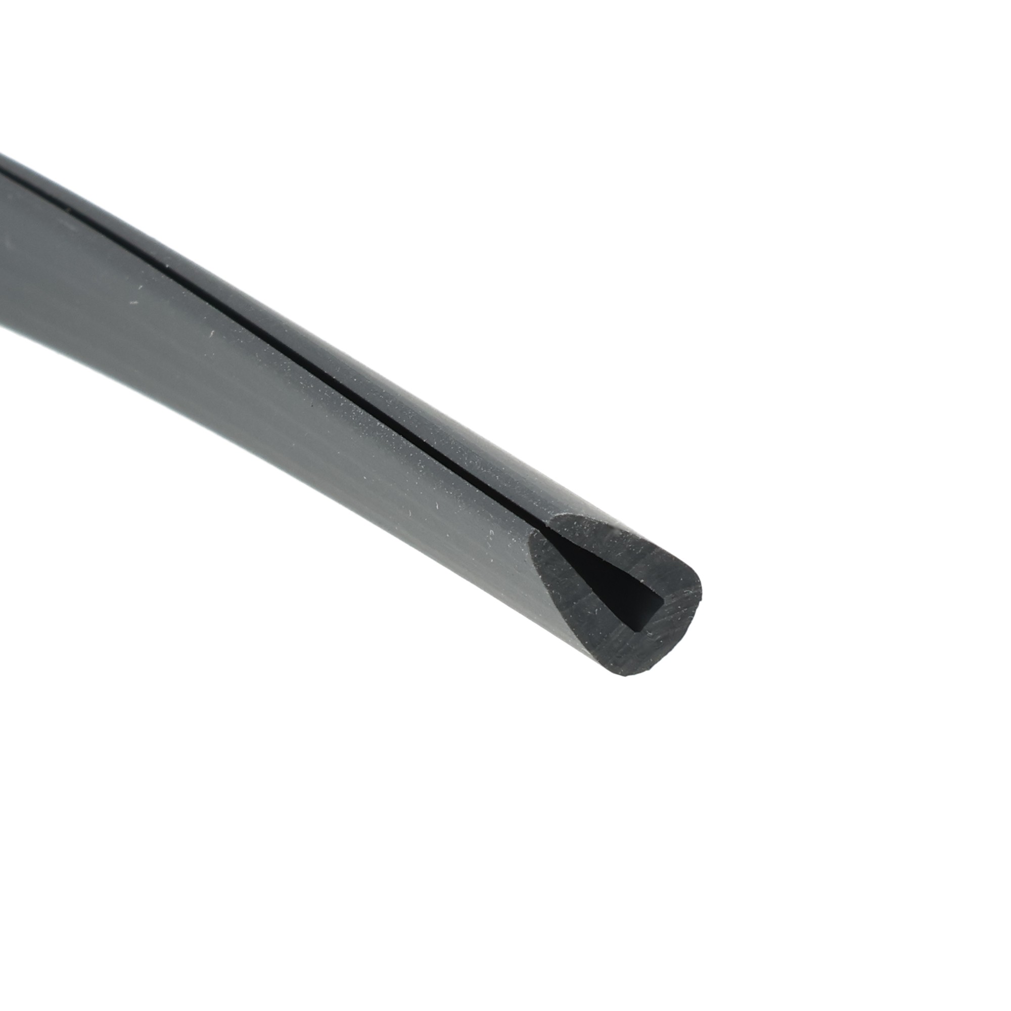 uszczelka-krawedziowa-miekkie-pvc-2-x-5-x-10mm-czarna-12-313-1 - Centrum uszczelek Close-up of a dark gray metal blade with a narrow central slit, angled across a white background