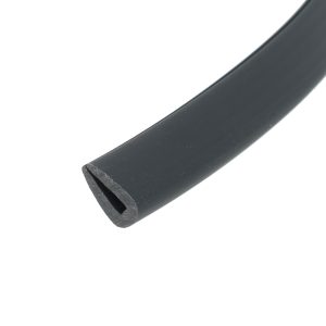 Close-up of a dark curved metal object with a beveled edge and a chipped end.